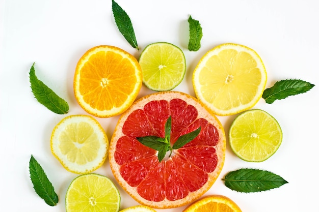 Citrus food - assorted citrus fruits with mint leaves.