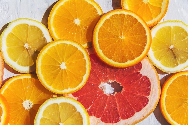 Citrus fruits. Orange, lemon, grapefruit,  on a trendy stone background  Top view, flat lay