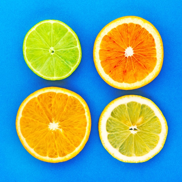 Citrus fruits slice. Juicy slice of lime, lemon, orange background.