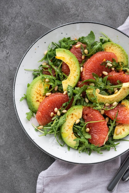 Citrus salad with grapefruit arugula and avocado Light vegetarian salad