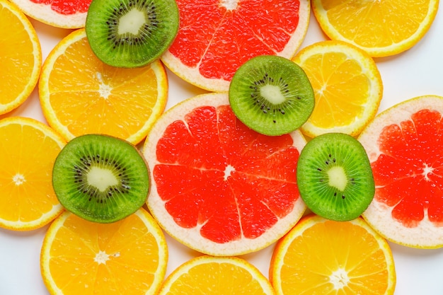 Citrus slice, kiwi, oranges and grapefruits.