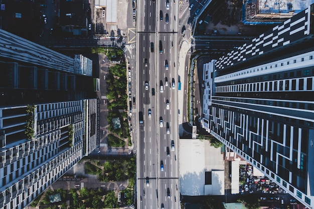 city asphalt road with vehicles and buildings