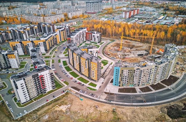 City block at autumn Modern multistorey buildings Construction of a multistorey building Aerial photography