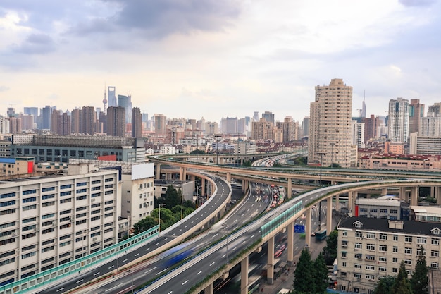 City highway overpass with car motion blur at dusk in shanghai