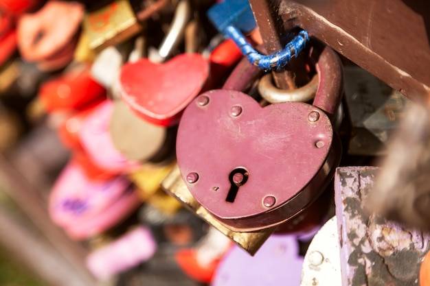 City landscape. Metal bridge with a lot of colorful locks. Wedding Traditions