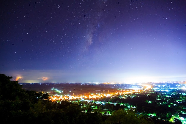 City landscape at nigh with Milky Way galaxy Long exposure photograph