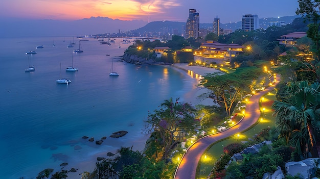 Photo a city at night with a view of the ocean and a city