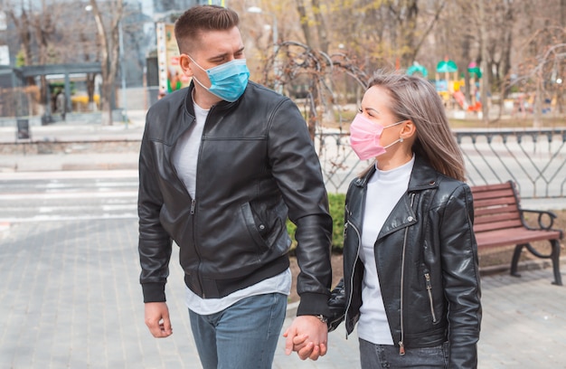 City residents adults and children wearing masks observe quarantine