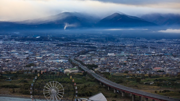 City scape at morming storm in the rainy season mountain cloud sky background in japan