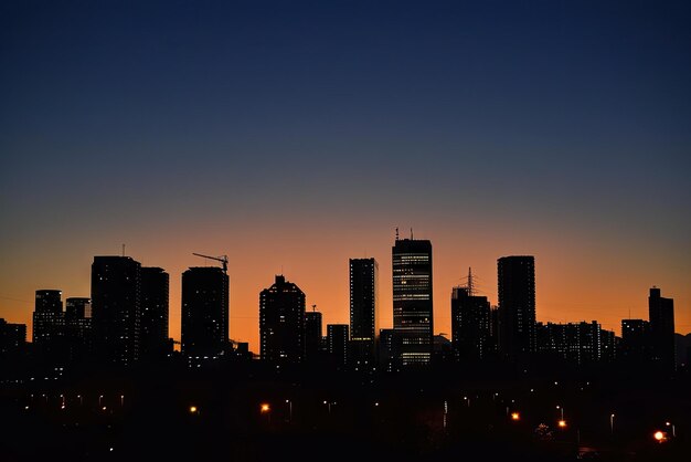 a city skyline with a few buildings in the background