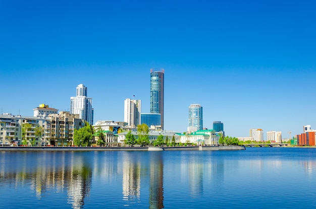 A city skyline with the river in the foreground