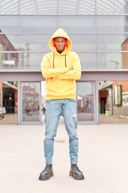 City style Fashion portrait of young african american Handsome man in casual clothes is posing in the city fulllength