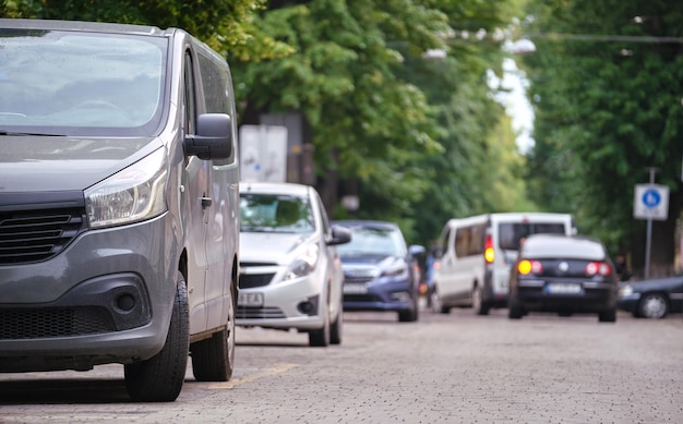 City traffic with cars parked in line on street side