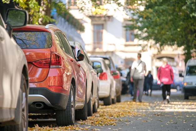 City traffic with many cars parked in line on street side