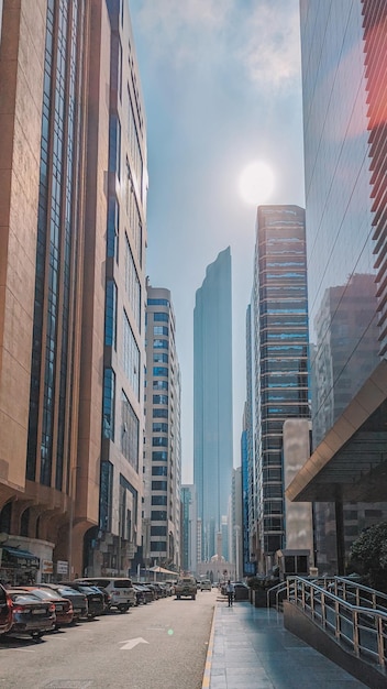 A city with a lot of buildings and a street with a large building in the middle.