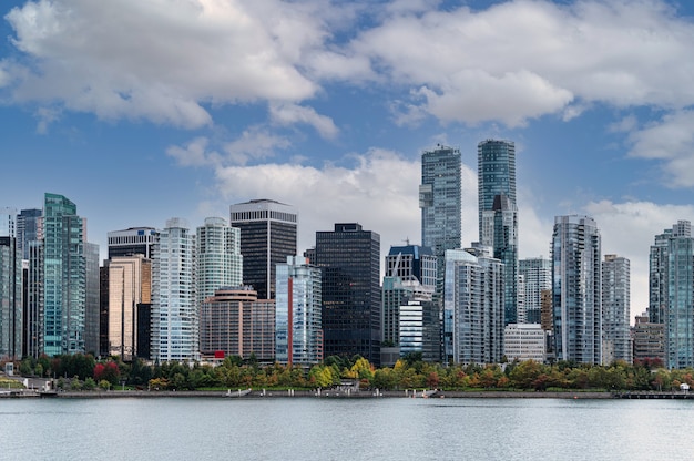 Cityscape of Crowded business buildings and blue sky on coastline in downtown at Stanley Park, Vancouver, Canada