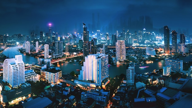 Cityscape of futuristic Bangkok city background at night in Thailand