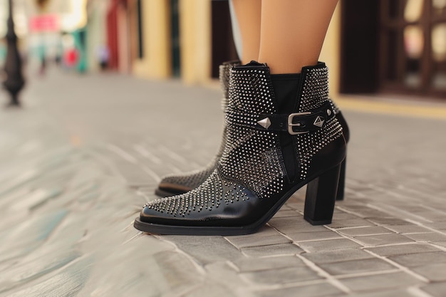 Cityscape Glam Womens Boots on Blurry Urban Background