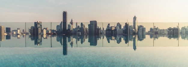 Cityscape and highrise buildings in metropolis city with water reflection