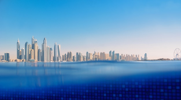 Cityscape of modern Dubai Marina with reflection in water