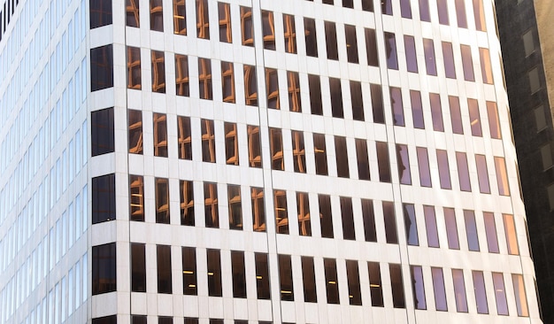 cityscape with sleek towering skyscrapers in the golden hour light representing urban growth corp