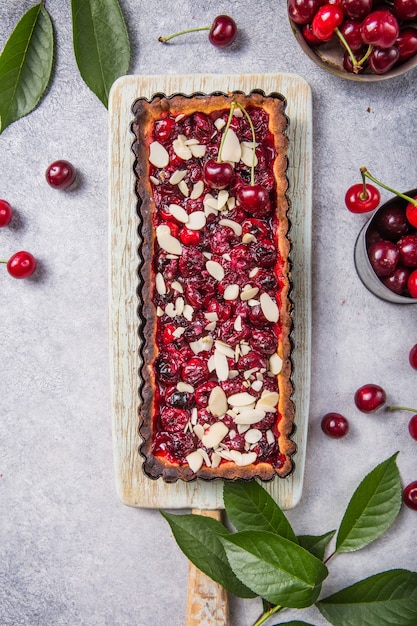 Clafouti cherry pie on black stone