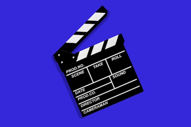 Clapperboard for shooting video footage takes on a blue background