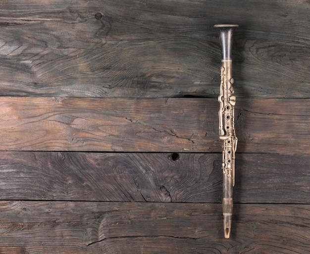 clarinet isolated on wooden background