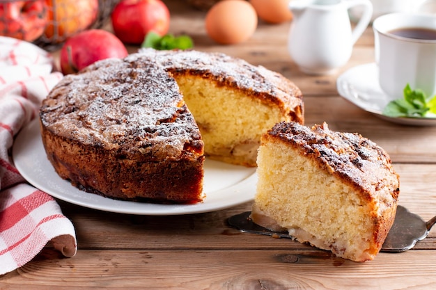 Clasic sponge cake selective focus Homemade pie on rustic wooden table