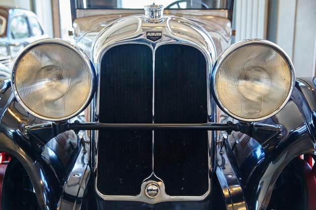 Classic Auburn Car Front Detail with Chrome Grill and Headlights