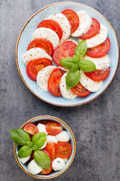 Classic caprese salad. Mozzarella tomatoes and  Basilikum.