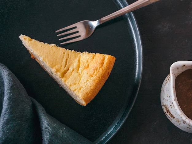 Classic Cheesecake on dark background Top view