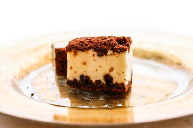 Classic cheesecake with chocolate on a golden plate european cuisine dessert