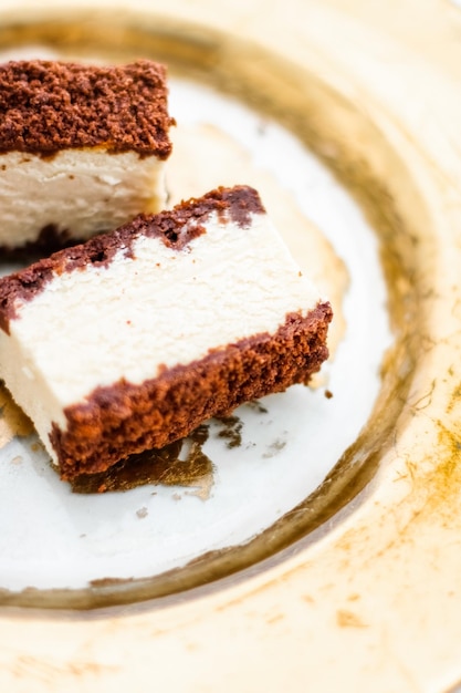 Classic cheesecake with chocolate on a golden plate european cuisine dessert