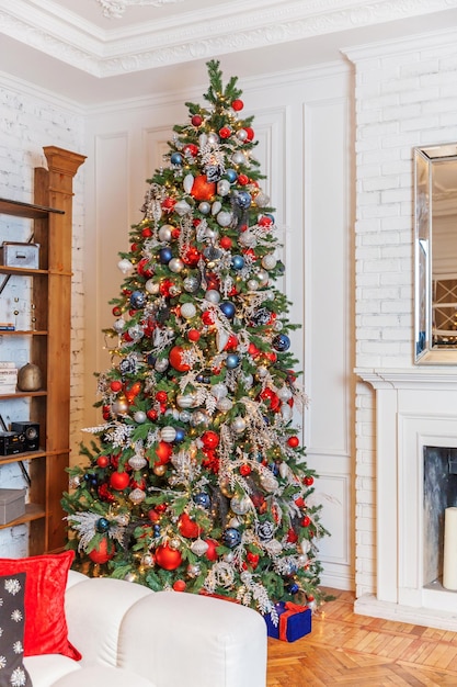 Classic christmas New Year decorated interior room New year tree with silver and red ornament decorations