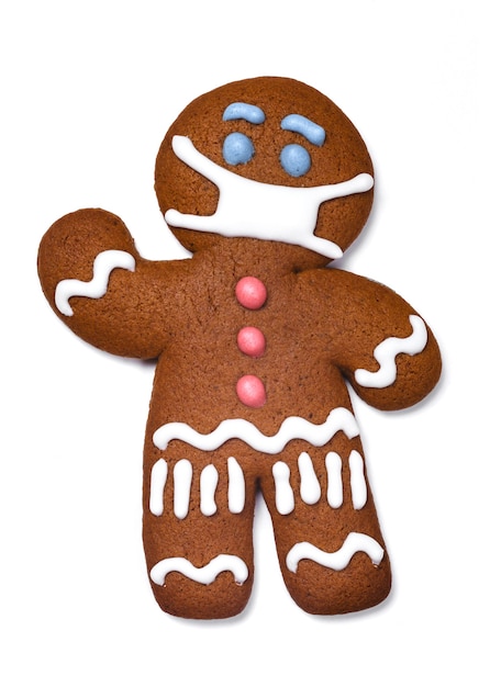 Classic gingerbread cookie man with medical mask on white background