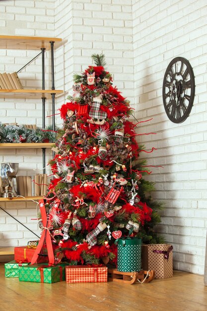 Classic green tree decorated with christmas toys.