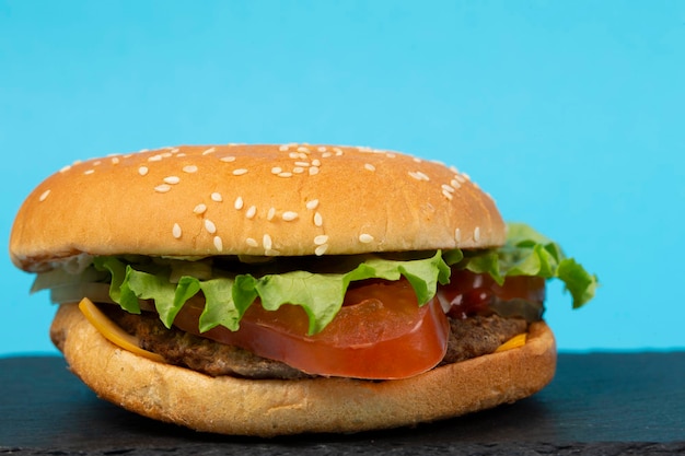 Classic hamburger closeup on a blue background