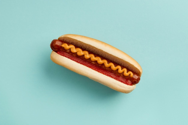 Classic hot dog with wurst ketchup and mustard on blue background menu for restaurant