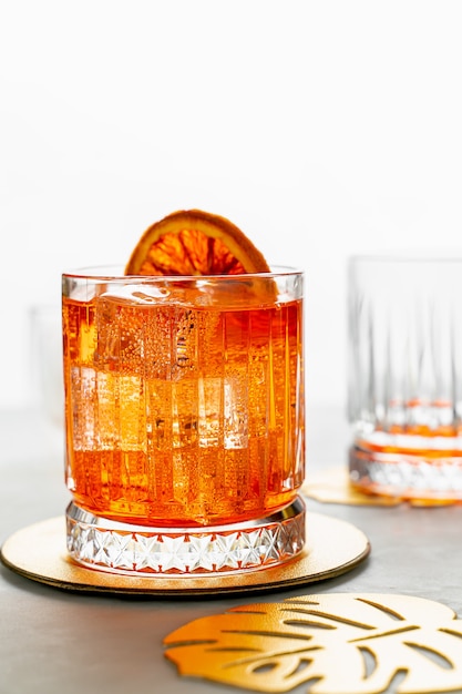 Classic Italian Aperol Spritz cocktail. Closeup view, portrait orientation