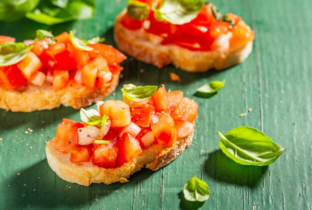 Classic italian bruschetta served on wooden board