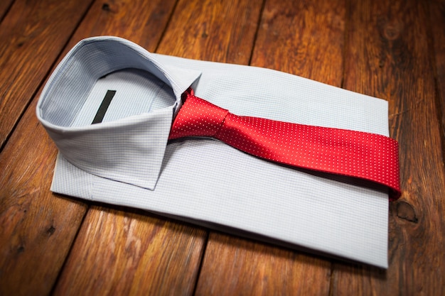 Classic look. Male clothes set. White shirt with red tie