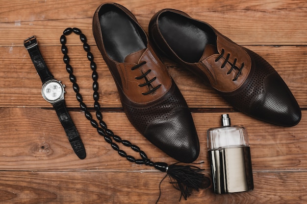 Classic men's accessories on the brown table.