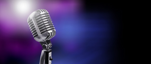 A classic musical microphone on blur colorful background