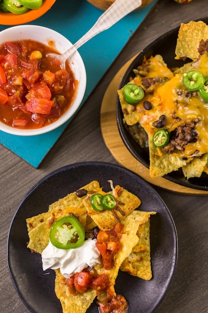 Classic nachos with ground beef and fresh jalapeno chili peppers.