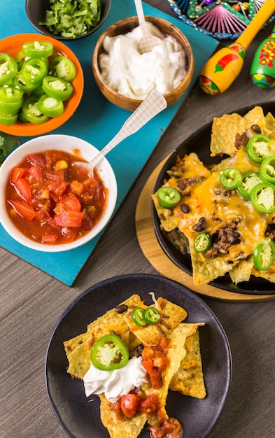 Classic nachos with ground beef and fresh jalapeno chili peppers.