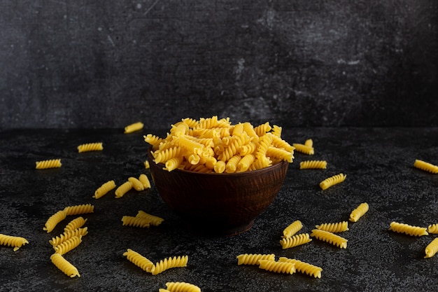 Classic pasta in a small black bowl