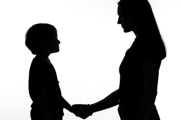 Classic portrait silhouette of mom and child