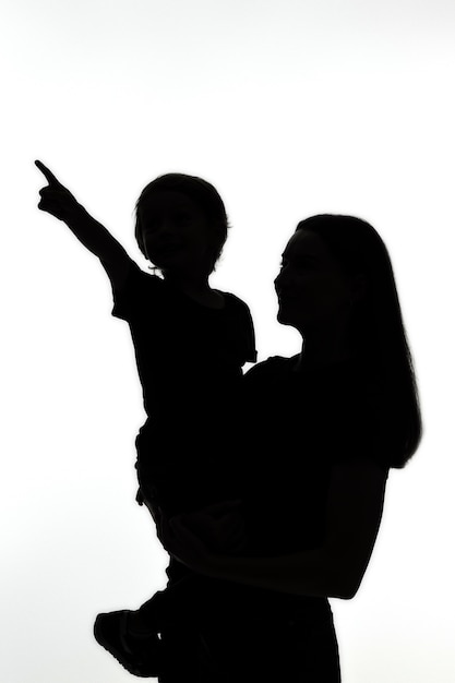 Classic portrait silhouette of mom and child