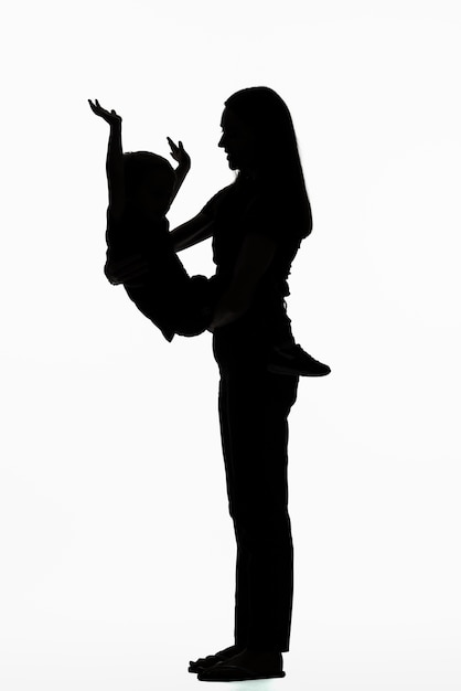 Classic portrait silhouette of mom and child